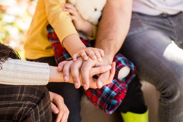 Family forming stack of hands