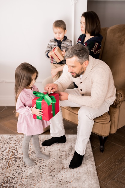 Family Giving Presents to Kids