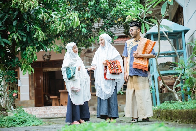 Family going to the mosque to do idul fitri or eid mubarak prayer