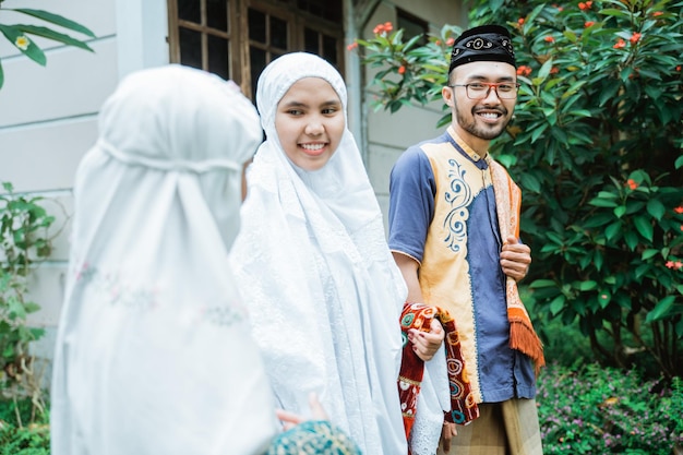 Family going to the mosque to do idul fitri or eid mubarak prayer