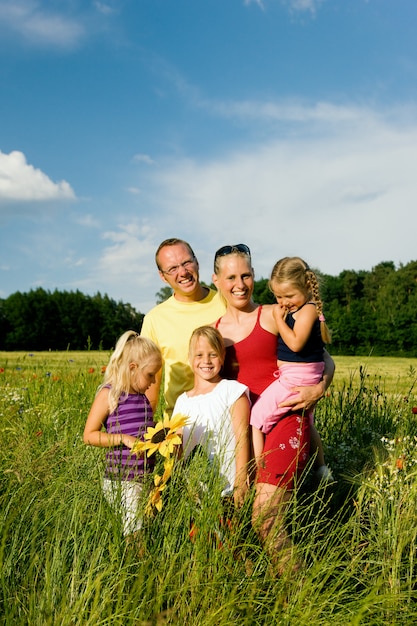 family in a grass field