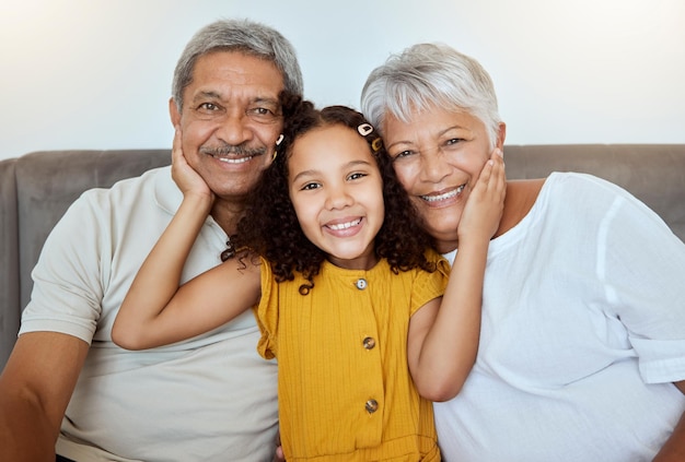 Family happy and girl on a home living room sofa with grandparents love and care together Portrait of senior people and a child with happiness smiling on a house lounge couch spending quality time