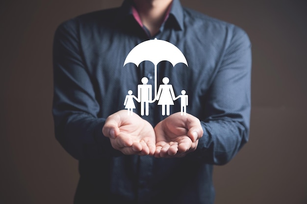 Family icon with umbrella Family protection Man holding in his hand