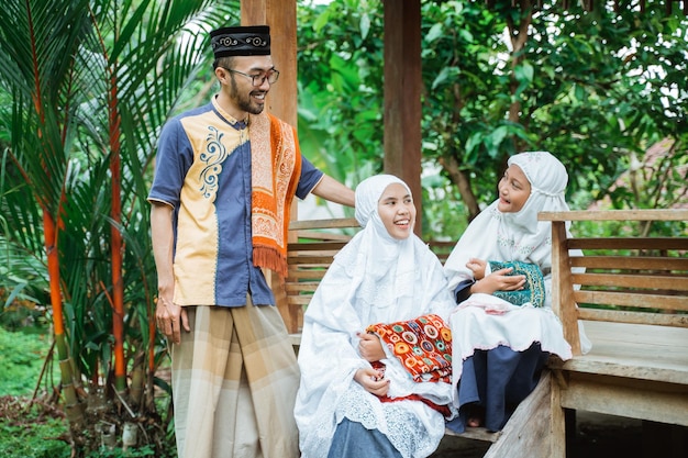 Family muslim sitting in the garden and having a conversation