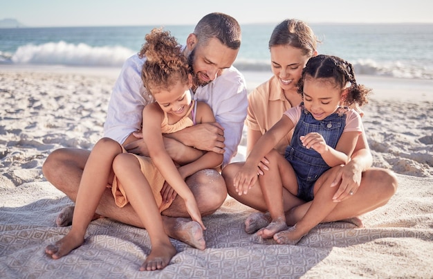 Family ocean and kids with parents on blanket in sand on summer holiday Mom dad and children relax at beach picnic in Mexico Freedom fun and vacation happy man and woman with girls at the sea