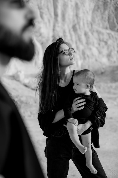 Family photo shoot in nature concept of happy childhood for children Problems and difficulties of raising children and the joy of care and parenthood for a young family