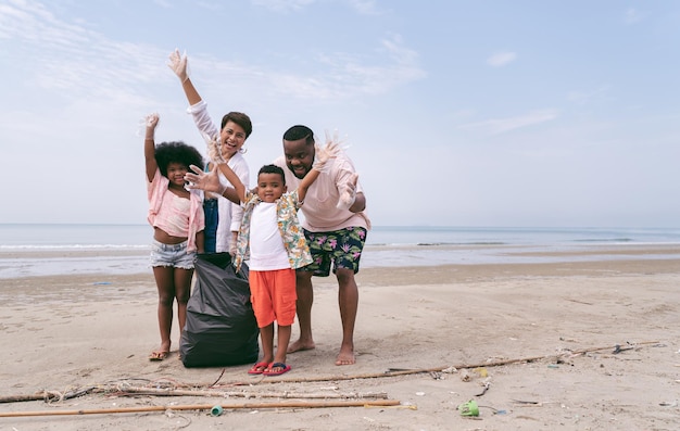 Family picking up garbage activity on the beach