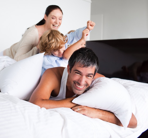 Family playing with pillows