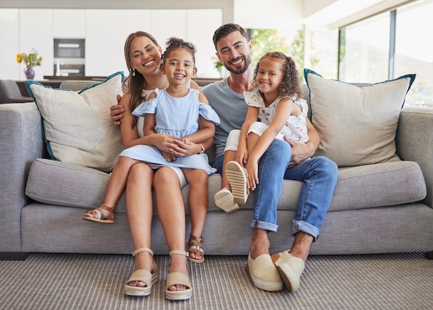 Family portrait happy and smile of parents with kids relaxing on living room sofa in bonding happiness Father mother and children smiling in love comfort and relax on couch in holiday together