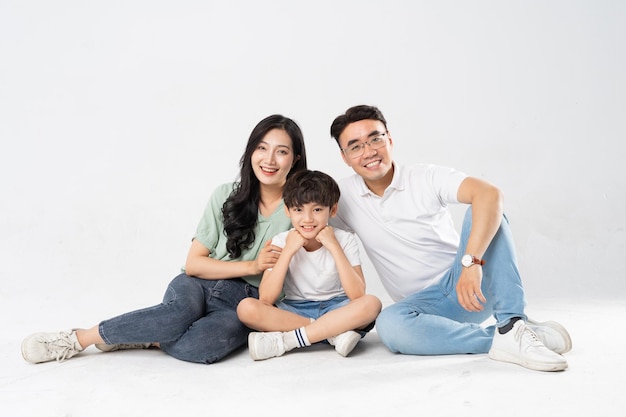 a family posing on a white background