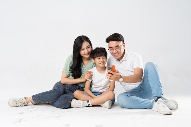 a family posing on a white background