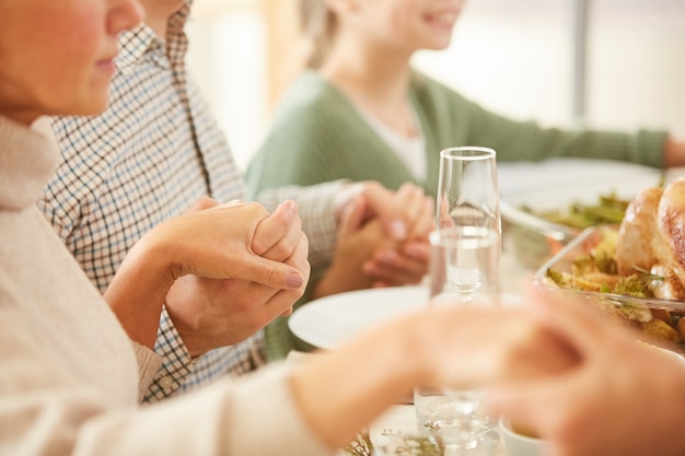 Family praying at the table