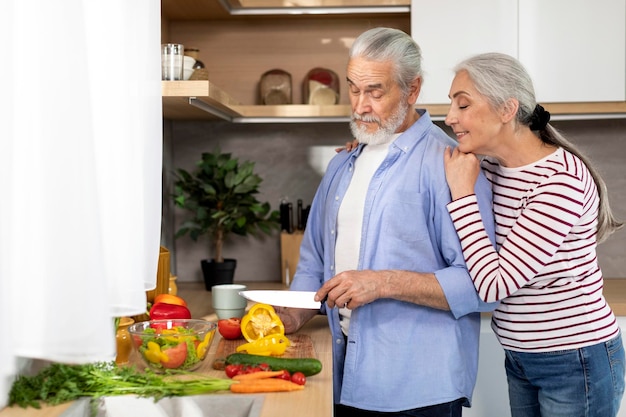 Family Recipes Concept Happy Elderly Couple Cooking Food For Lunch At Home