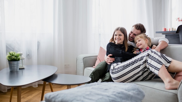 Family relaxing on couch