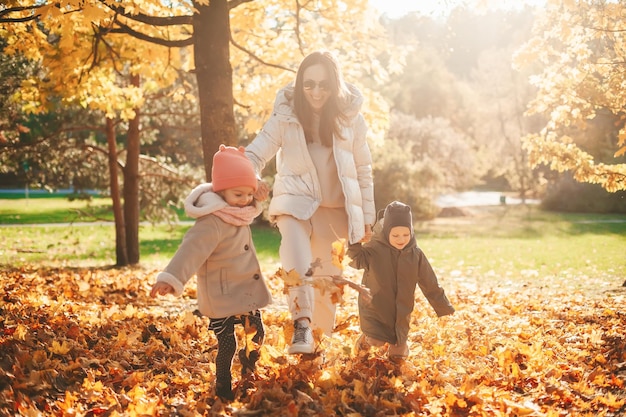 Family running in the autumn park