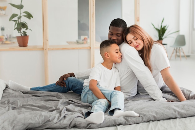 Family staying together in bed