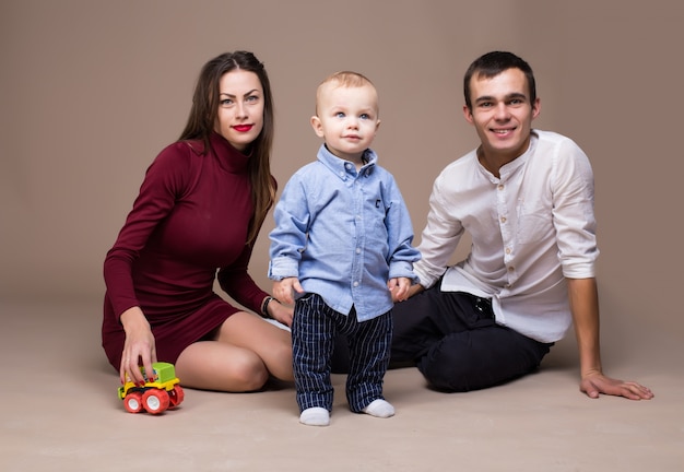 Family studio photography. Warm background 