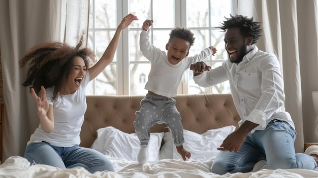 A family of three a man a woman and a child are playing together in a bedroom