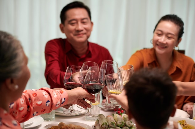 Family toasting with wine glasses