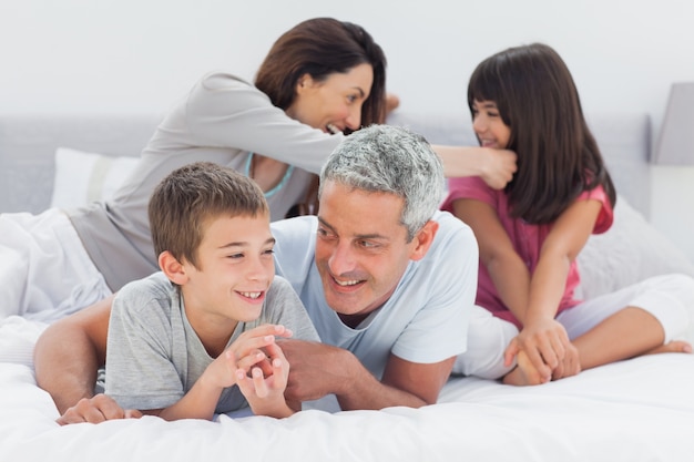 Family together on bed 