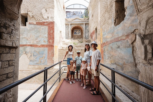 Family tourist posed at Pompeii ancient city Italy