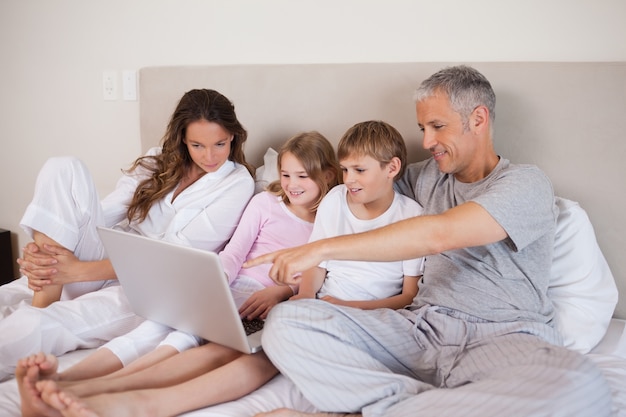 Family using a laptop