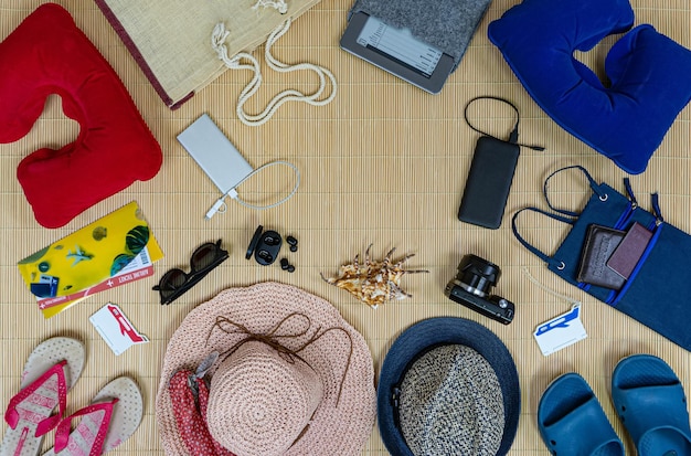 Family vacation accessories on the beach mate Top view