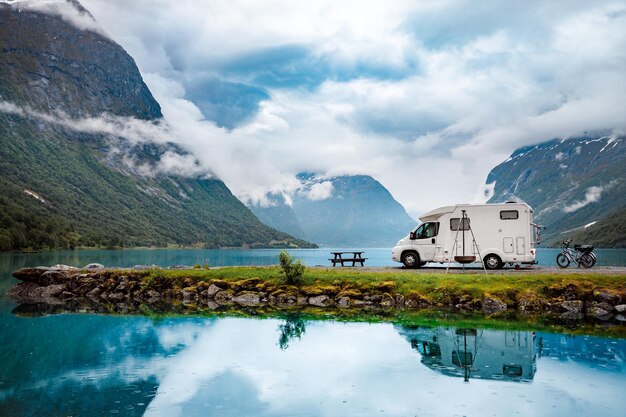 Family vacation travel RV, holiday trip in motorhome, Caravan car Vacation. Beautiful Nature Norway natural landscape.