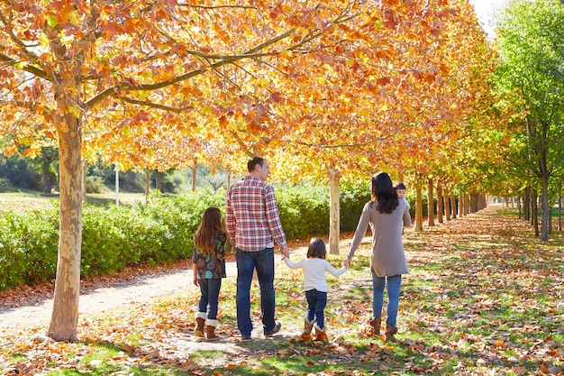 family walking in an autumn park