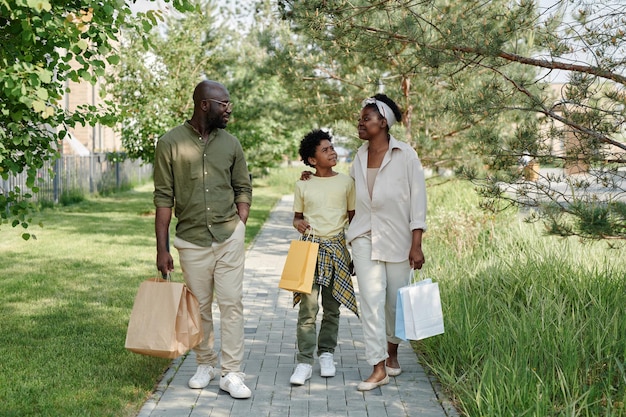 Family walking outdoors after shopping