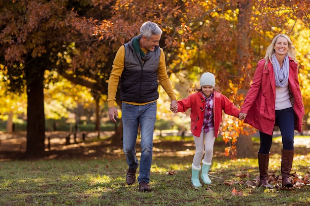 Family walking at park during autumn