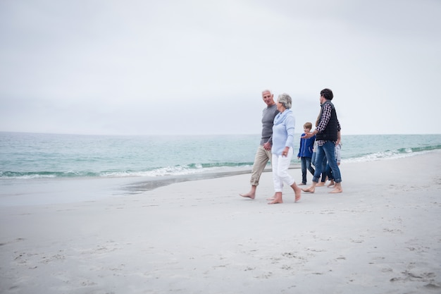 Family walking together on the beach