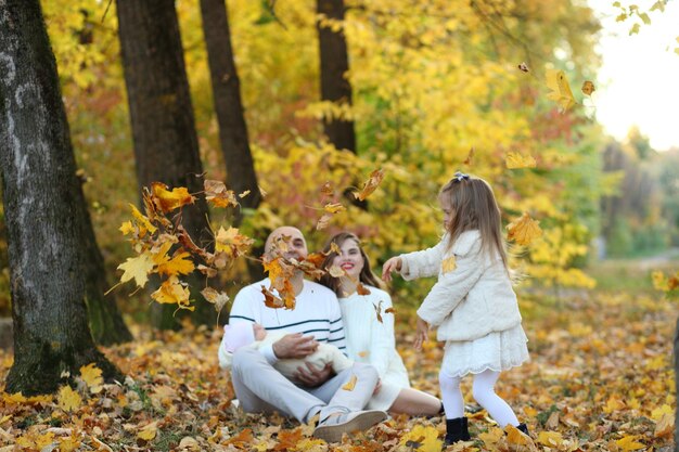 Family walking together in the forest during day