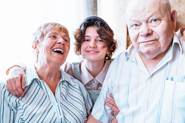 A family with a child and a woman smiling