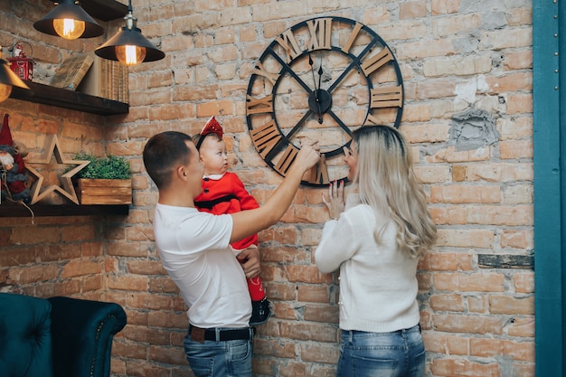 Family with a small daughter celebrating New Year