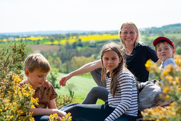 Family with three children on a walk in a mountainous area