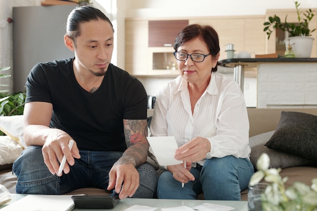 Family working with bills at home