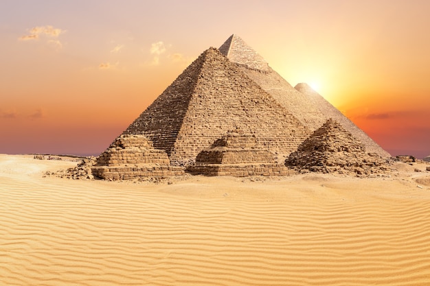 The famous Giza Pyramids in the desert at sunset, Egypt.