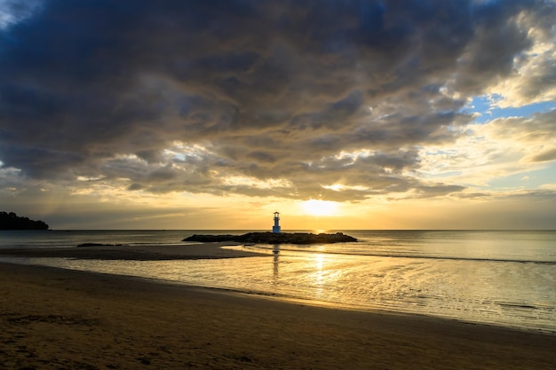 Famous Khao Lak beach with light beacon or lighthouse for navigation during sunset PhangNga Thailand