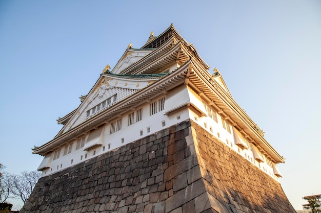 The famous landmark is osaka castle in autumn at japan