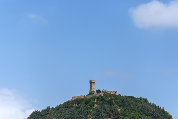 Famous medieval stone fortress Rocca of Radicofani on hilltop in Val d'Orcia, Tuscany, Italy