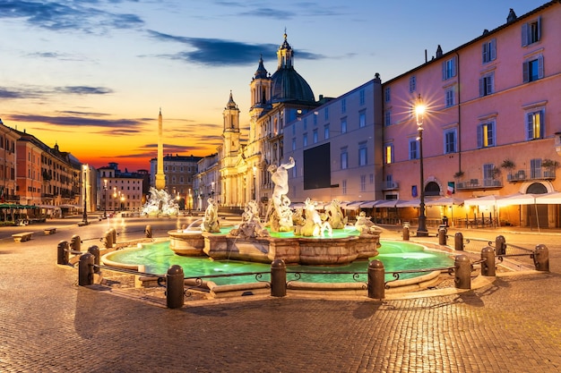 Famous Piazza Navona at sunset with the Fountain of Neptune Rome Italy