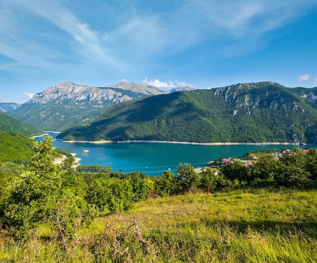 The famous Piva river canyon with its fantastic reservoir Piva Lake Pivsko Jezero and Pluzine town summer view in Montenegro Nature travel background