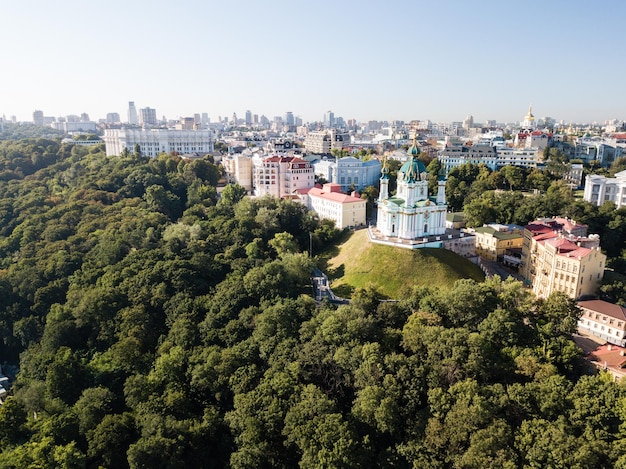 Famous touristic places in Kyiv Aerial view to St Andrew's Church in capital of Ukraine and Podil region