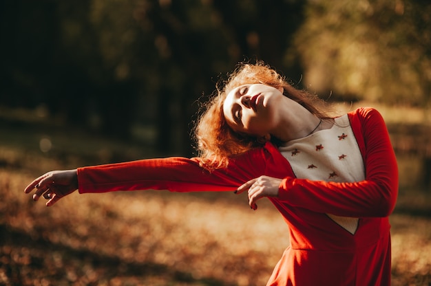 Fantastic redhead girl in a mysterious forest