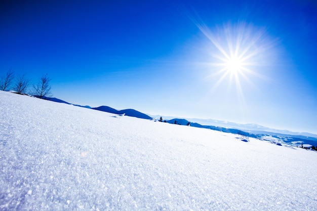 Fantastic winter landscape and trodden trails that lead into the mountains In anticipation of the holiday Carpathian montains Ukraine High quality photo