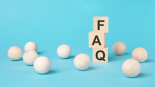 Faq short for exchange to exchange on a wooden cubes on a blue background