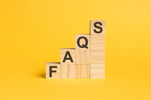 FAQS text on wooden cubes on wooden background