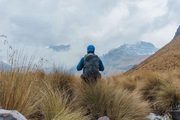 Far view of hiker walking with backpack downhill in iztaccihuatlpopocatepetl Valley