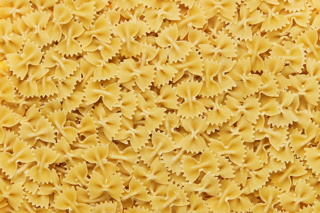 Farfalle pasta made from light dough closeup Pasta background